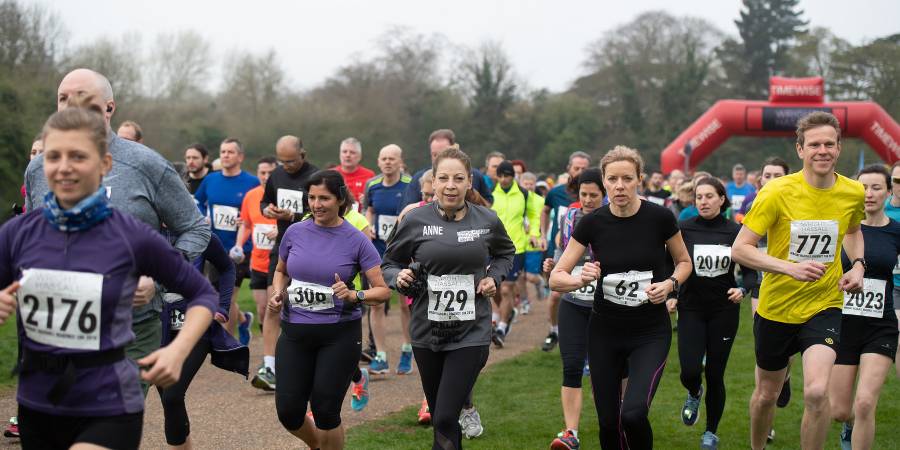 Crowd of runners competing in the Wright Hassall Regency run