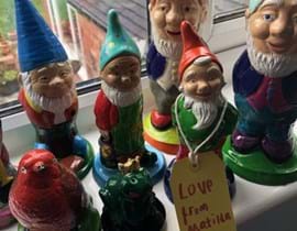 Garden gnomes painted by a child for charity