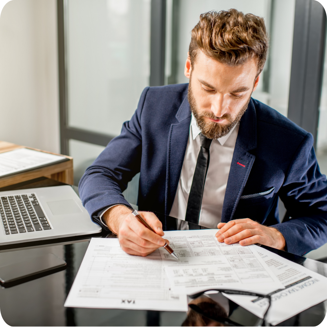 Business man filling out tax forms