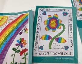 Paintings of rainbow and colourful flower by Eesha and Anika 