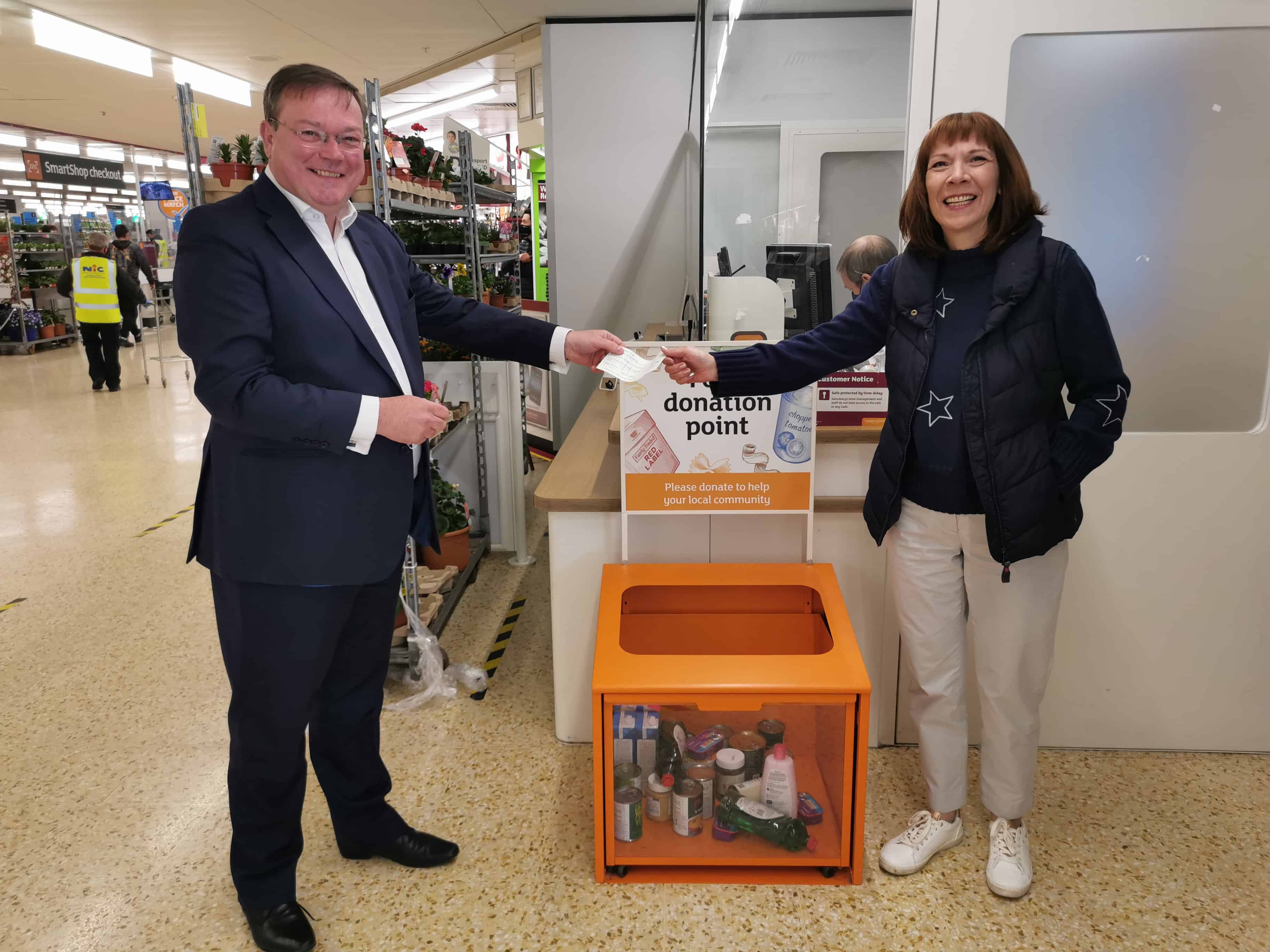Robert Lee, Wright Hassall handing cheque to Julie Thomas