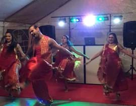 Indian dancing with people in traditional dress
